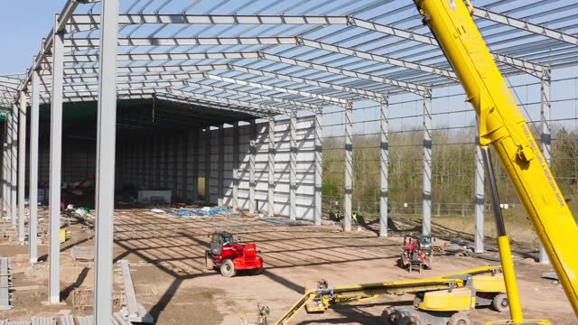 Warehouses and distribution centres are being constructed across the country as demand for distribution centres and storage facilities grows. This aerial view shows a warehouse during the construction phase.